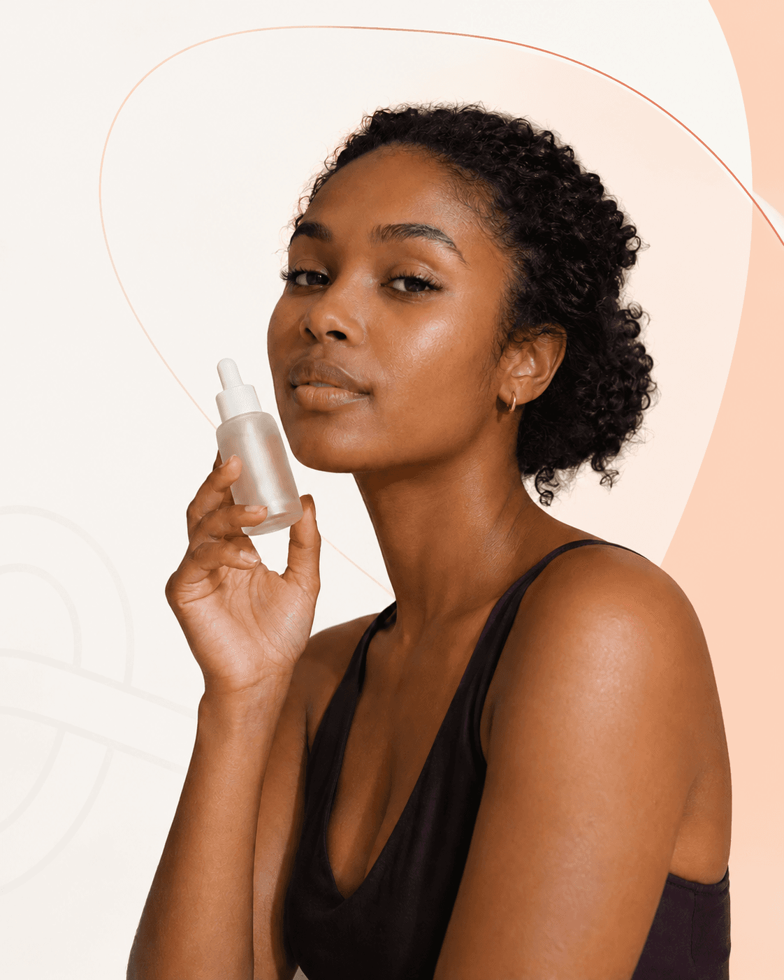 Beauty creator holding a skincare serum bottle, close-up editorial lighting