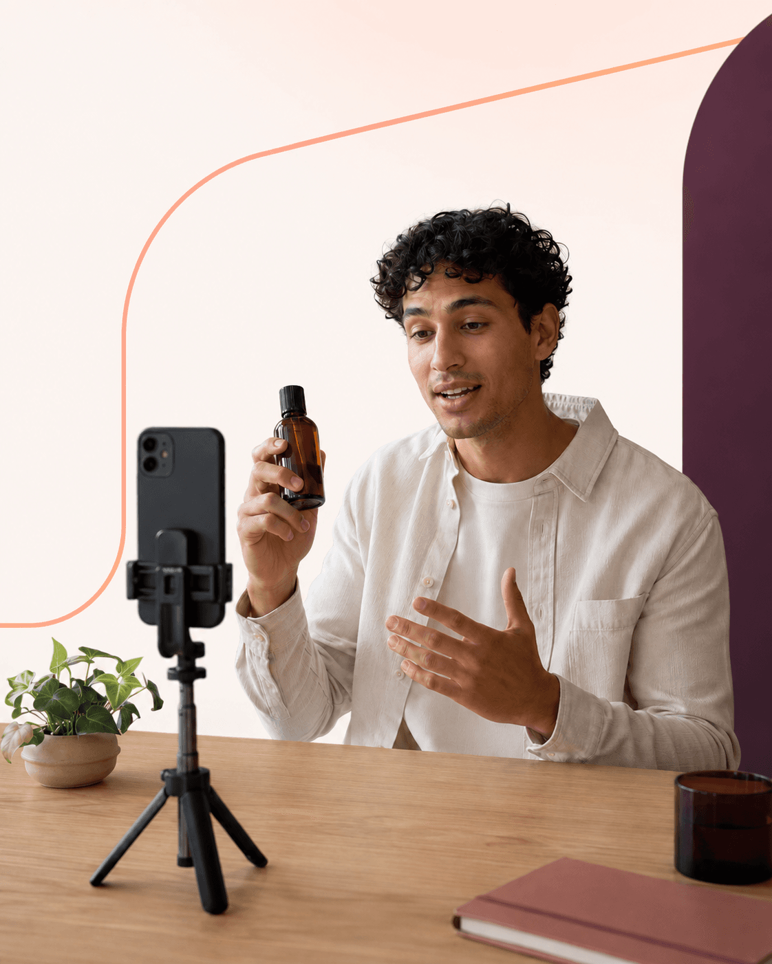 UGC creator holding a product bottle up to a phone on a tripod